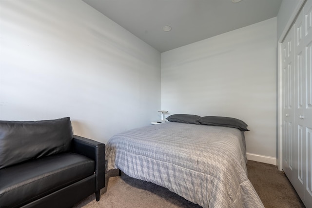 carpeted bedroom featuring a closet