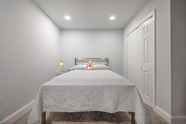 carpeted bedroom with a closet