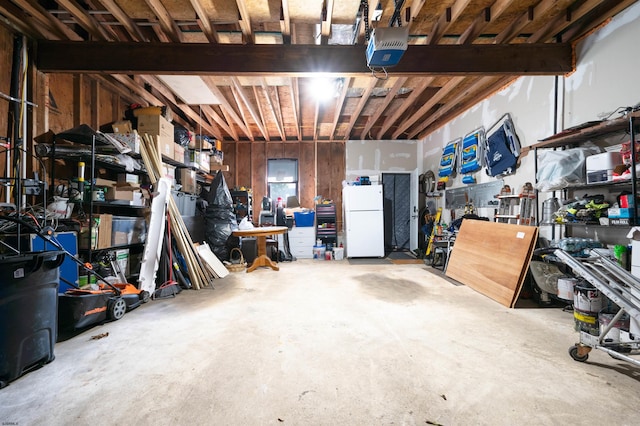 basement featuring white refrigerator