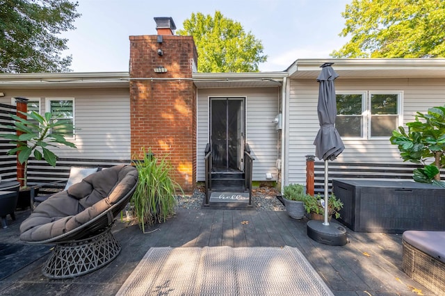 rear view of house featuring a wooden deck and central AC unit