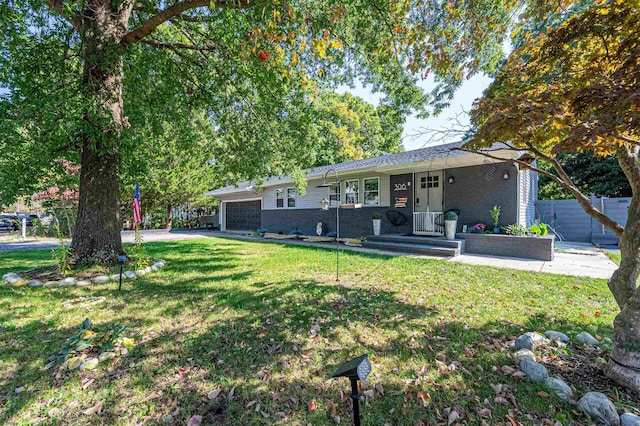 ranch-style house with a front yard and a garage