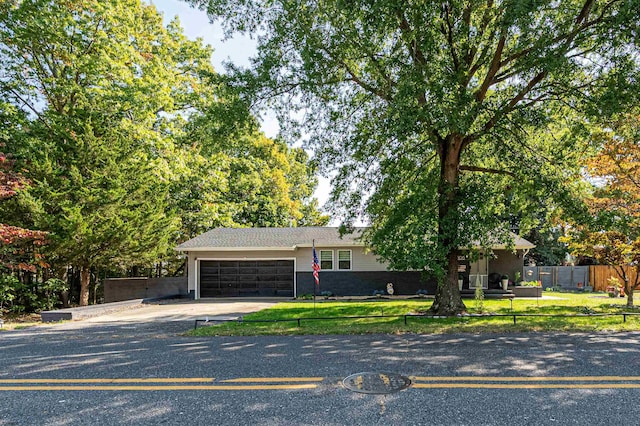 view of front facade with a garage and a front lawn