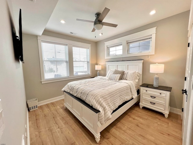 bedroom featuring light hardwood / wood-style floors and ceiling fan