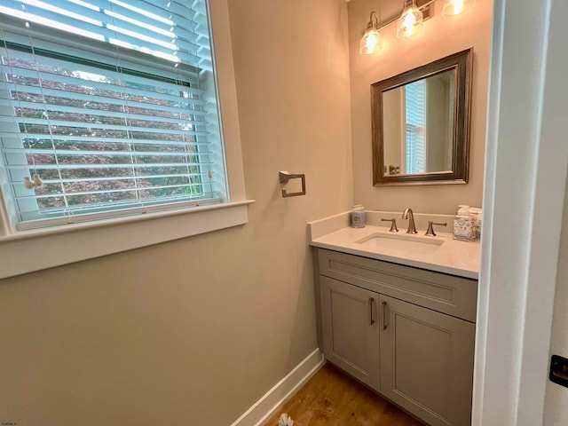 bathroom with vanity and hardwood / wood-style floors