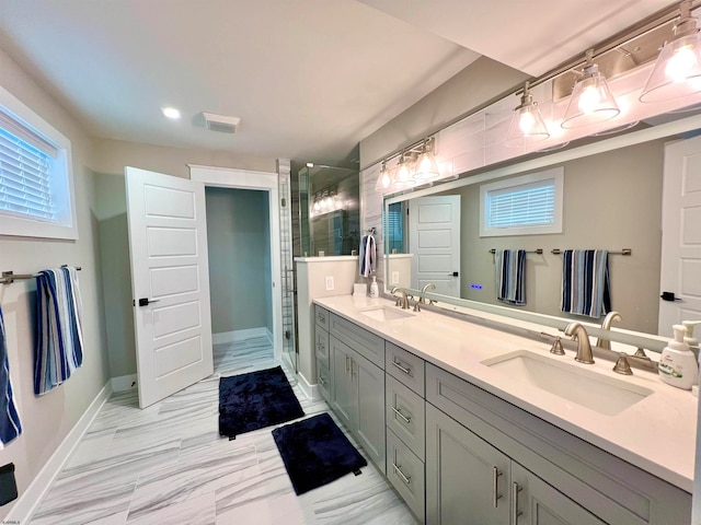 bathroom featuring vanity and an enclosed shower