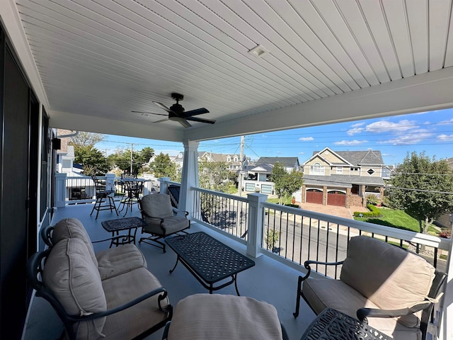 view of patio featuring a balcony and ceiling fan