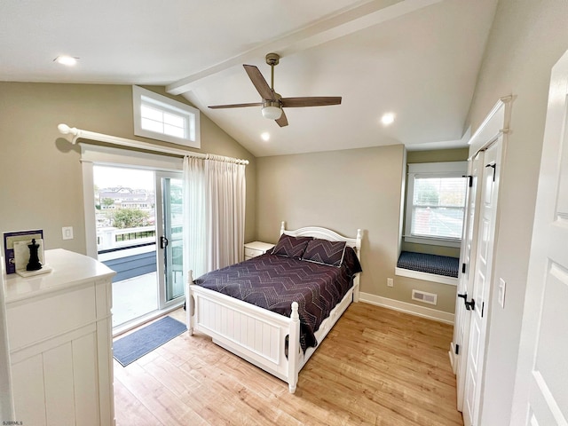 bedroom featuring vaulted ceiling with beams, multiple windows, light hardwood / wood-style floors, and ceiling fan