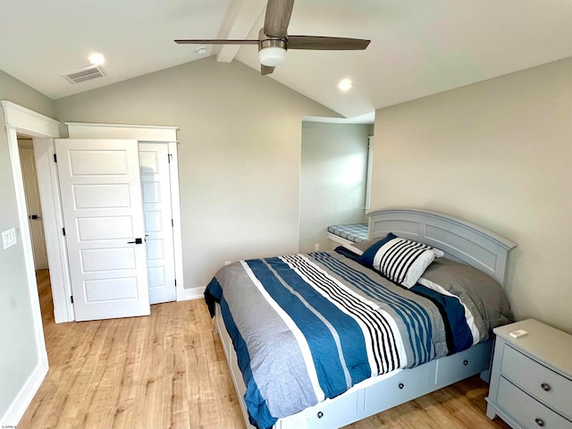 bedroom featuring light hardwood / wood-style flooring, lofted ceiling with beams, and ceiling fan