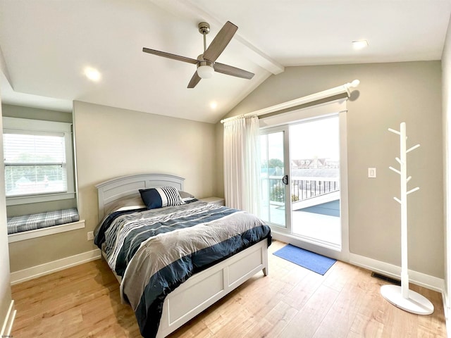 bedroom featuring light hardwood / wood-style flooring, ceiling fan, lofted ceiling with beams, and multiple windows