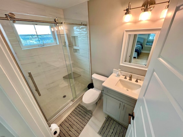 bathroom featuring vanity, an enclosed shower, toilet, and tile patterned floors