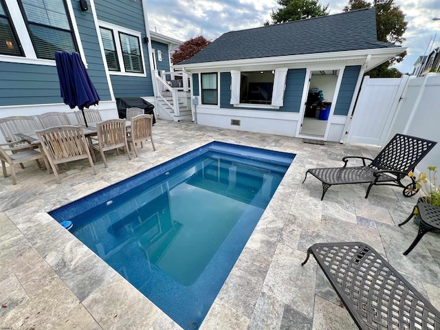 view of swimming pool with a patio and an outdoor living space