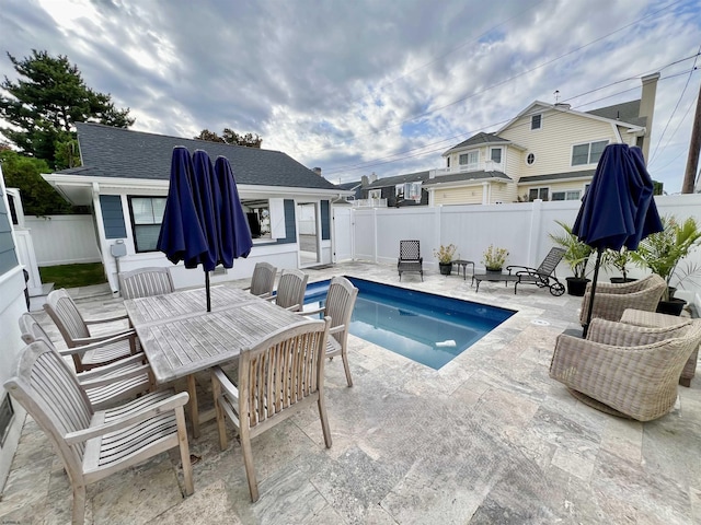 view of swimming pool with a patio area