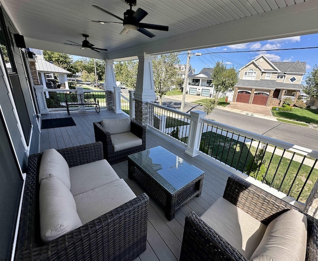 deck featuring ceiling fan and an outdoor hangout area