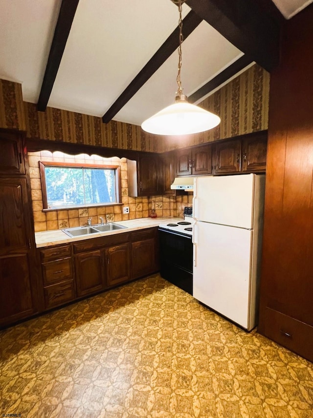 kitchen with beam ceiling, sink, hanging light fixtures, and white appliances