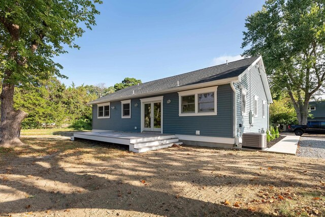 view of front of house featuring a wooden deck and central AC unit