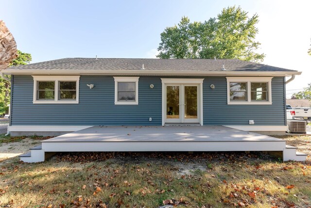 back of house with french doors and a wooden deck