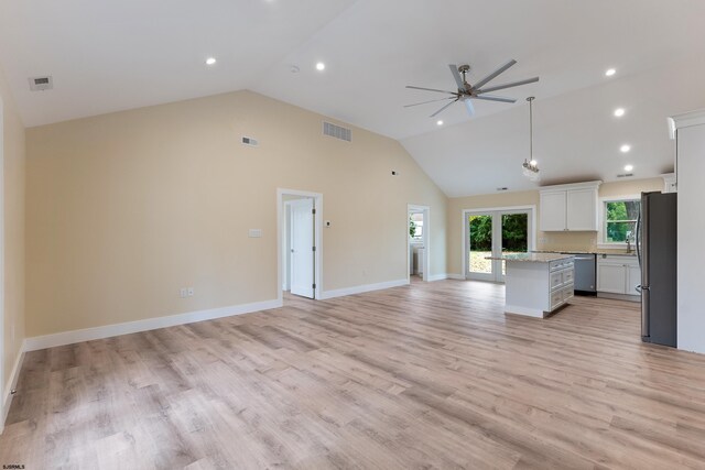 kitchen featuring white cabinets, ceiling fan, light wood-type flooring, french doors, and stainless steel appliances