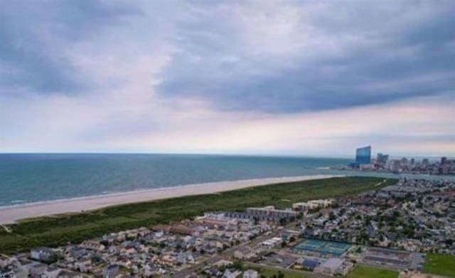 bird's eye view featuring a water view and a city view