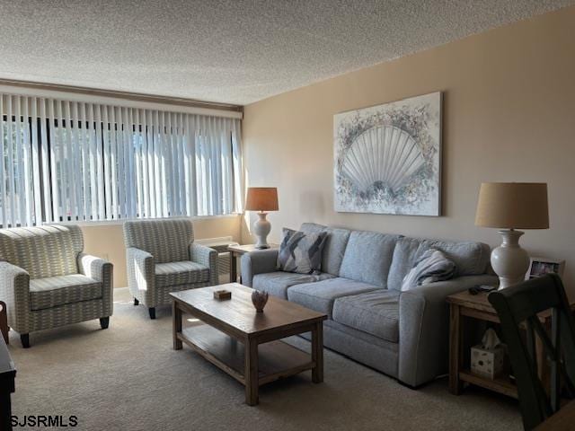 carpeted living room with a textured ceiling