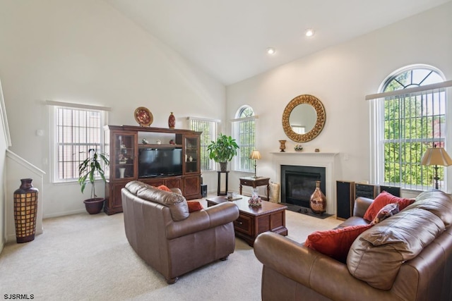 living room with light carpet and high vaulted ceiling