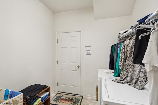 laundry room with washing machine and clothes dryer