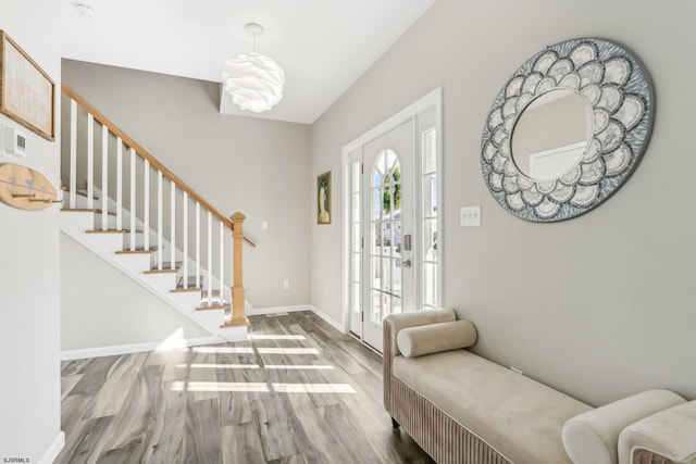 entryway featuring french doors and hardwood / wood-style flooring