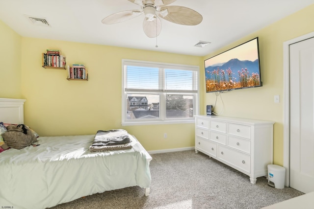 bedroom with light carpet and ceiling fan