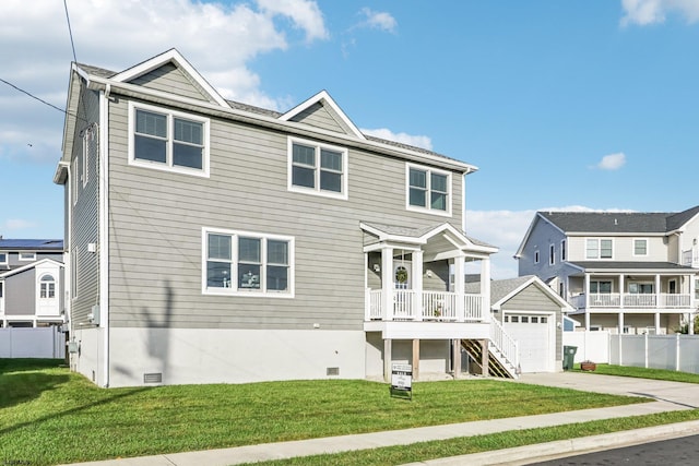 view of front of house featuring a front yard and a garage