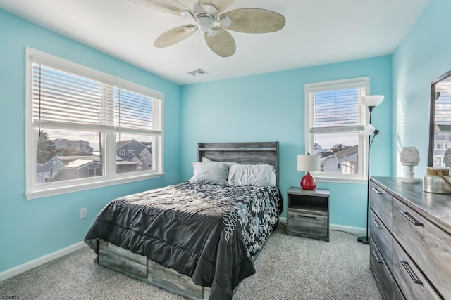 bedroom with light colored carpet and ceiling fan