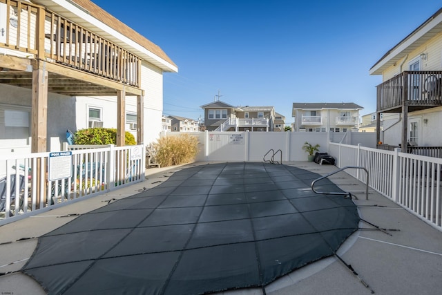 view of pool with a wooden deck