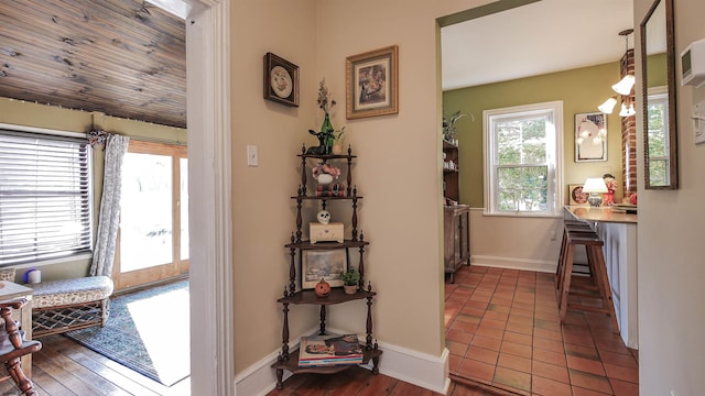 hall featuring wooden ceiling and dark hardwood / wood-style flooring