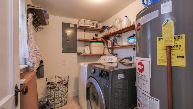 washroom featuring gas water heater, electric panel, and washing machine and dryer