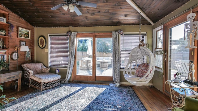 interior space with vaulted ceiling, wood ceiling, and ceiling fan