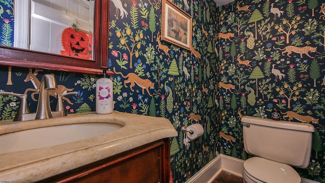 bathroom with vanity and toilet