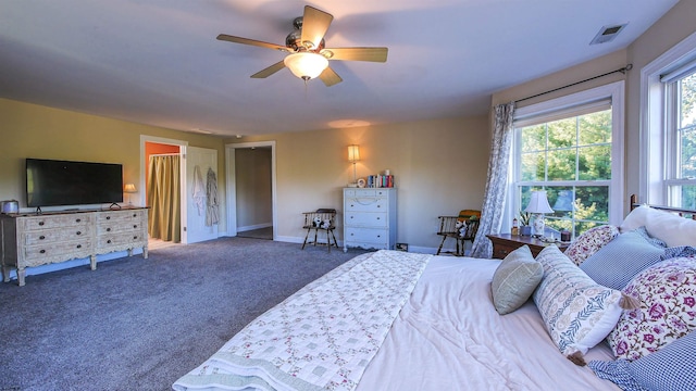 bedroom featuring dark carpet and ceiling fan