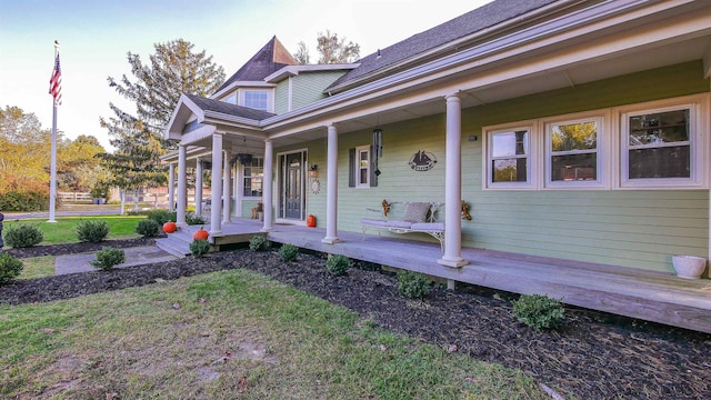 view of front of property with a front yard and a porch