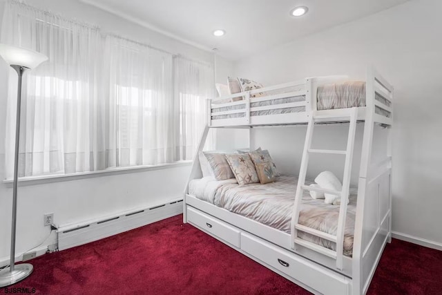 carpeted bedroom with a baseboard radiator