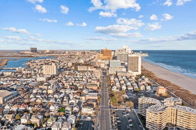 bird's eye view featuring a water view and a view of the beach