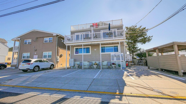 view of front of property with a balcony