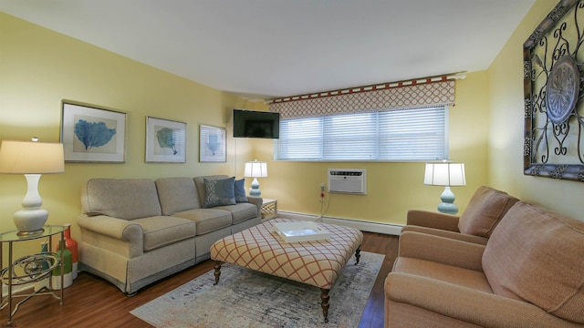 living room with a baseboard heating unit, a wall unit AC, and dark hardwood / wood-style floors