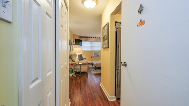 hall with a wall mounted AC and dark hardwood / wood-style flooring