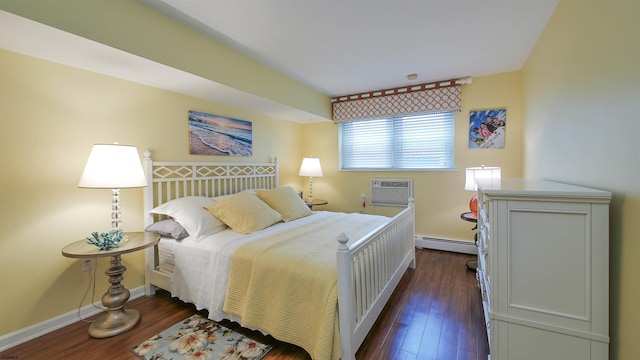 bedroom featuring a wall unit AC, baseboard heating, and dark wood-type flooring