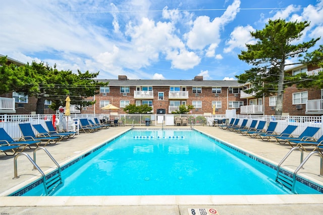 view of swimming pool with a patio area