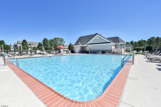 view of swimming pool featuring a patio