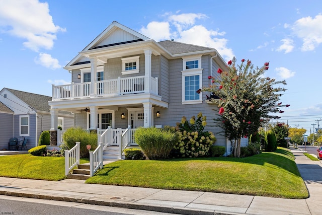 view of front facade featuring a front yard and covered porch