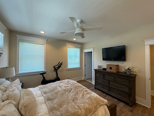 bedroom featuring ceiling fan and dark hardwood / wood-style flooring