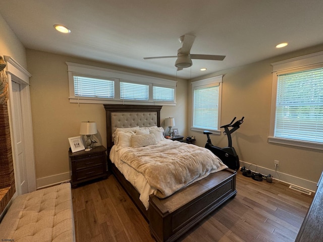 bedroom featuring hardwood / wood-style flooring and ceiling fan