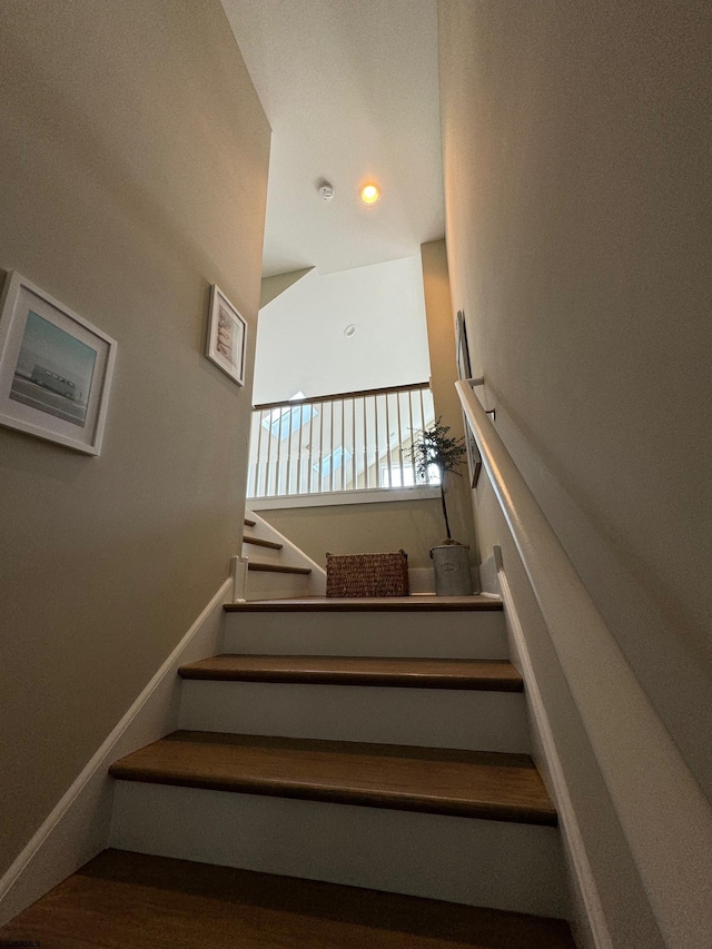 staircase featuring hardwood / wood-style flooring