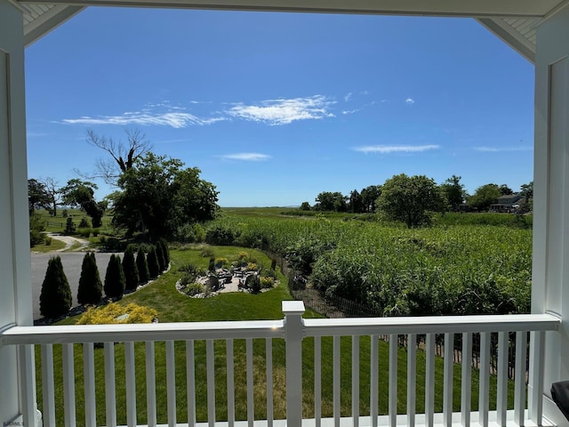 balcony featuring a rural view