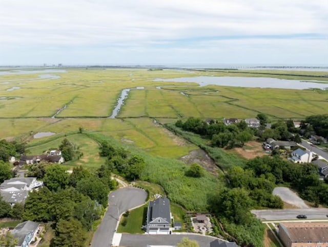 birds eye view of property featuring a rural view and a water view